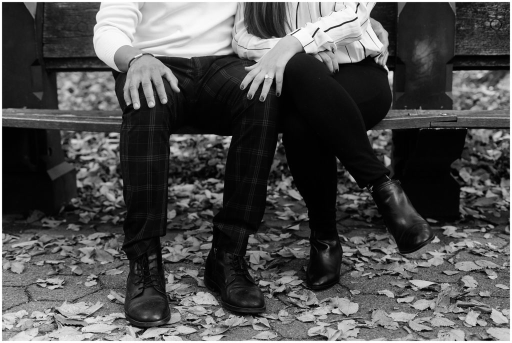 a couple sitting on a central park bench