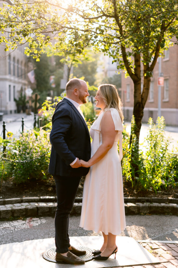 A couple holding hands and about to kiss 
